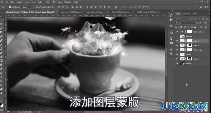 PS创意合成咖啡杯中的云雾雪山梦幻场景。
