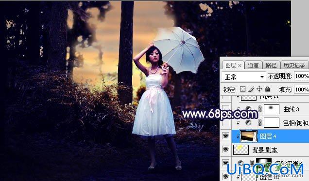 PS给森林中打伞拍照的女性婚纱照调出黄蓝色逆光效果